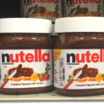 Nutella Hazelnut Spread with Cocoa Jars on a Shelf