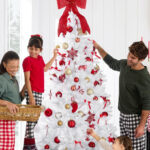 People decorating a Best Choice Products Premium 4 5 Foot Christmas Tree