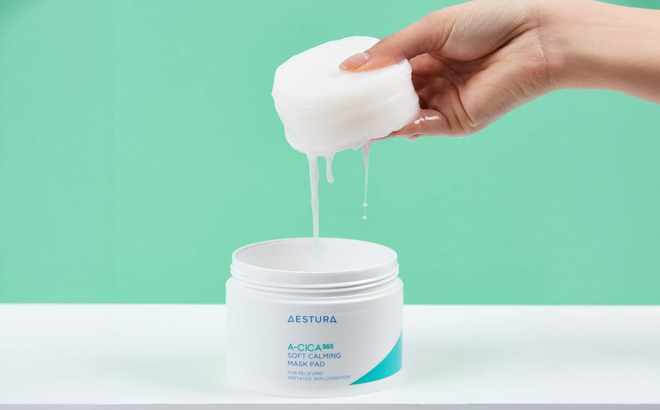 Person Holding Aestura A Cica Soft Calming Mask Pads