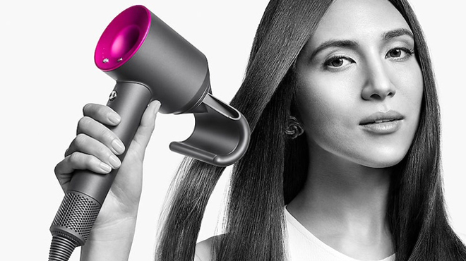 A Person drying their Hair with Dyson Supersonic Hair Dryer