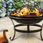 Pyramid Home Decor 3 Piece Fire Pit and Grill on a Patio