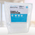 Room Essentials Waterproof Quilted Mattress Pad on a Table