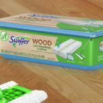 Swiffer Sweeper 20 Count Wood Floor Wet Mopping Cloths Box on a Floor