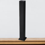 Sylvania SP263G Bluetooth Tower Speaker with FM Radio on a Table