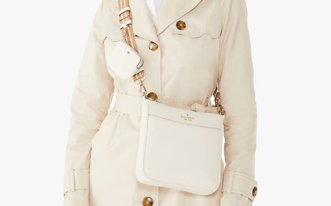 a Person Wearing Kate Spade Rosie North South Medium Swingpack Crossbody