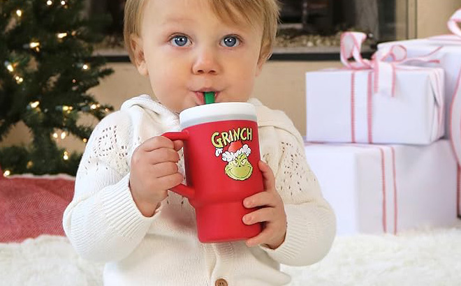 A Child Drinking From an Infantino Grinch My 1st Tumbler