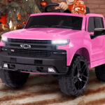 A Child Driving the Licensed Chevrolet Silverado 12V Kids Electric Ride on Truck in Pink