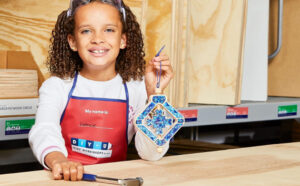 A Child Holding the Spinning Snowflake Lowes Free Workshop Craft