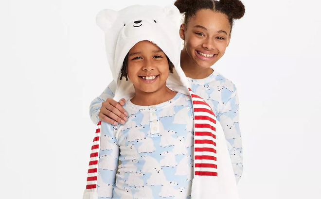 A Child Wearing the Wondershop Polar Bear Kids Hooded Blanket