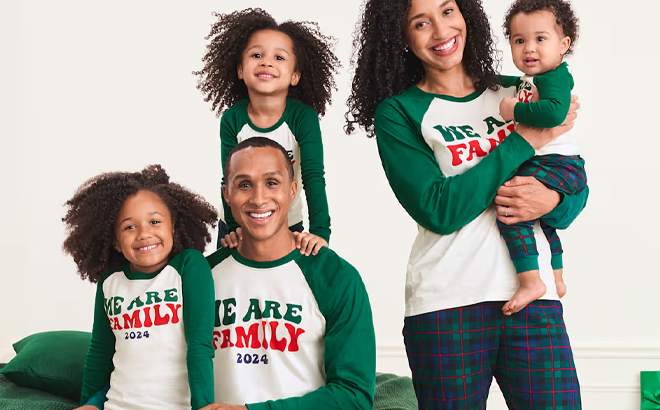 A Family Wearing the Matching The Childrens Place Holiday Pajamas