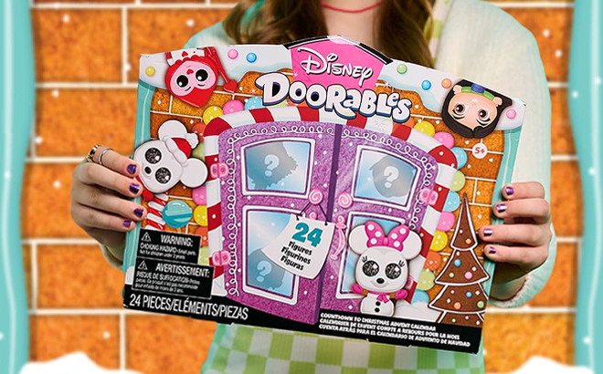 A Girl Holding the Disney Doorables Countdown to Christmas Advent Calendar