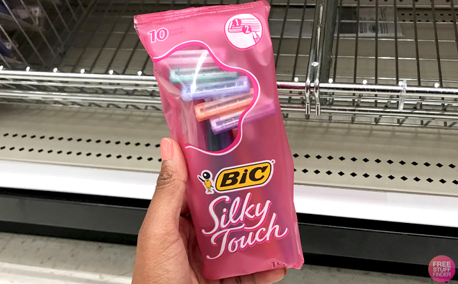 A Hand holding BIC Silky Touch 10 Count Razors Pouch