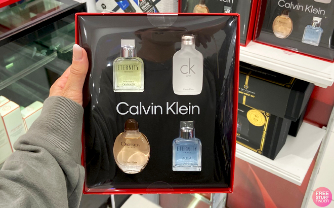 A Hand holding Calvin KleinMens 4 Piece Eau de Toilette Gift Set