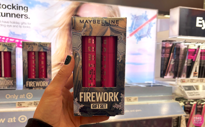 A Hand holding Maybelline Lash Sensational Firework Holiday Gift Set