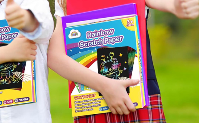 A Kid Holding Rainbow Scratch Paper