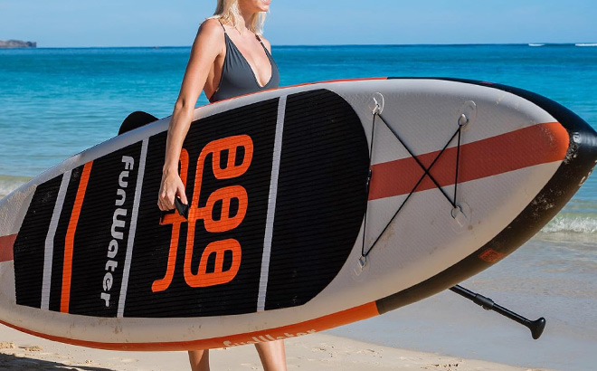 A Person Carrying a FunWater Inflatable Stand Up Paddle Board