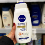 A Person Holdin Nivea Nourishing Botanical Bolssom Body Wash