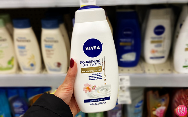 A Person Holdin Nivea Nourishing Botanical Bolssom Body Wash