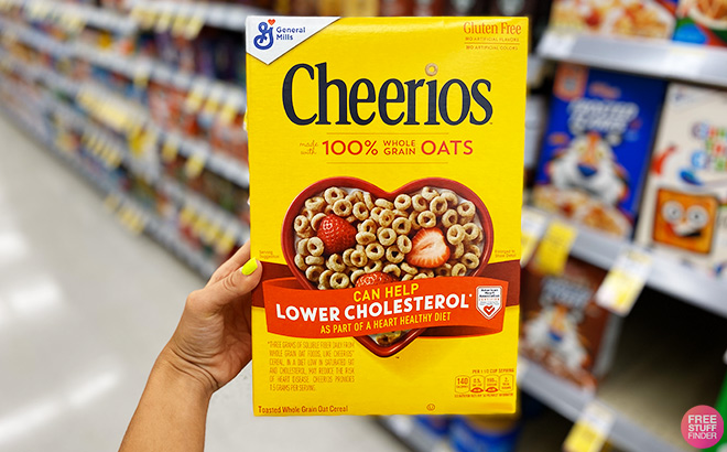 A Person Holding Cheerios Cereals