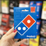 A Person Holding Dominos Pizza Gift Card