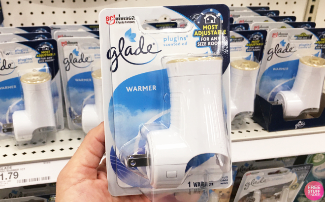 A Person Holding Glade Plug Ins Air Freshener Warmer