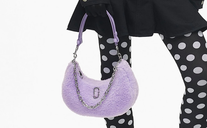 A Person Holding Marc Jacobs The Teddy Curve Bag