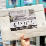 A Person Holding Members Mark Egyptian Cotton Hotel Premier Sheet Set