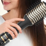 A Person Holding Nicebay Hair Dryer Brush