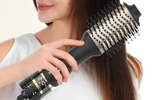 A Person Holding Nicebay Hair Dryer Brush