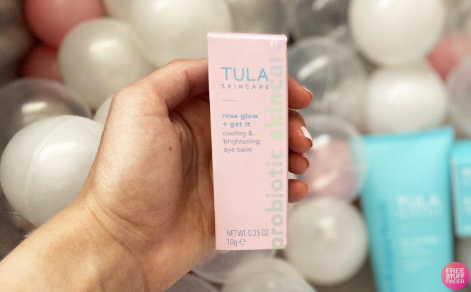 A Person Holding Tula Skin Care Eye Balm