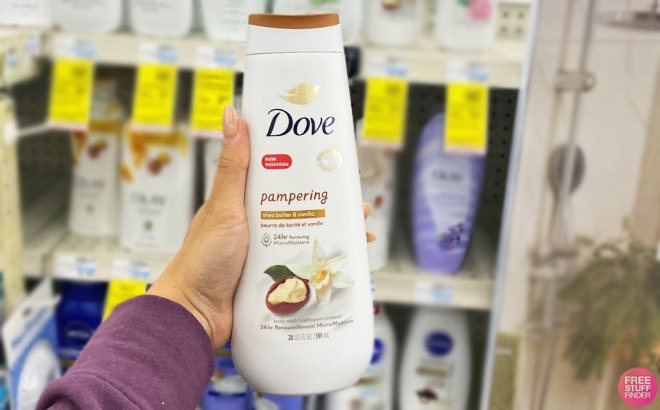 A Person Holding a Bottle of Dove Pampering Body Wash