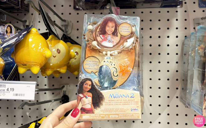 A Person Holding a Disney Moana 2 Moana Light Up Shell Necklace