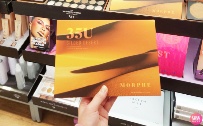 A Person Holding a Morphe 35U Gilded Desert Artistry Palette