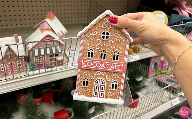 A Person Holding the Bullseyes Playground LED House Props Cocoa Cafe at Target