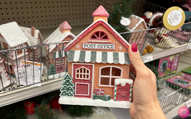 A Person Holding the Bullseyes Playground LED House Props Post Office at Target