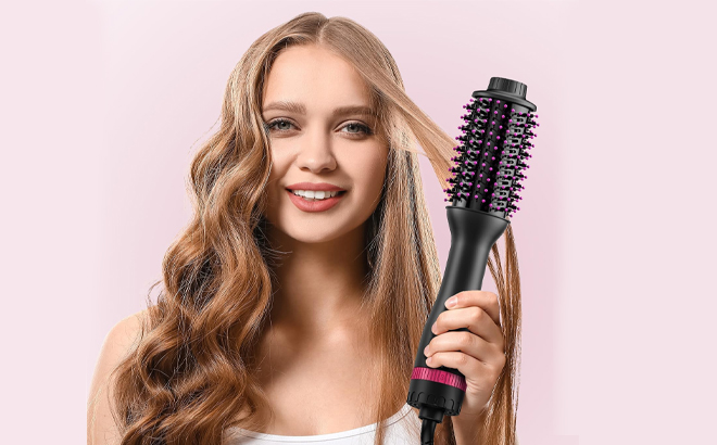 A Person Holding the MiroPure 4 in 1 Hair Dryer and Styler Volumizer Brush