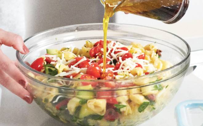 A Person Preparing a Salad Using a Mainstays Mixing Bowl