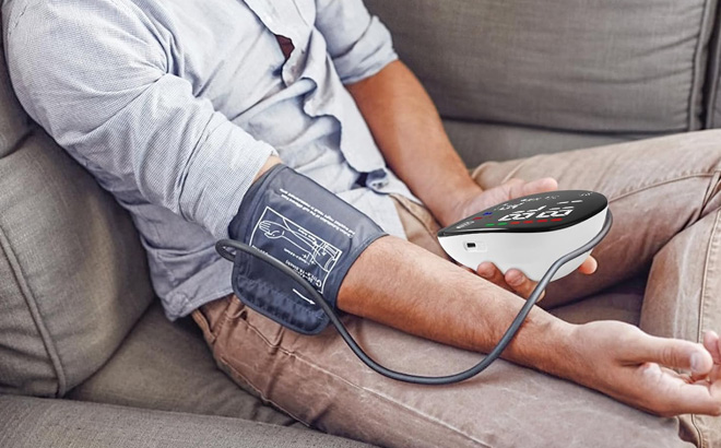 A Person Using Blood Pressure Machine