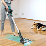 A Person Using Inse Cordless Stick Vacuum