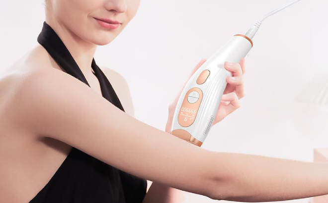 A Person Using a Artolf Laser Hair Removal