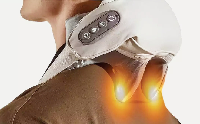 A Person Using a Brookstone Trapezius Kneading Massager