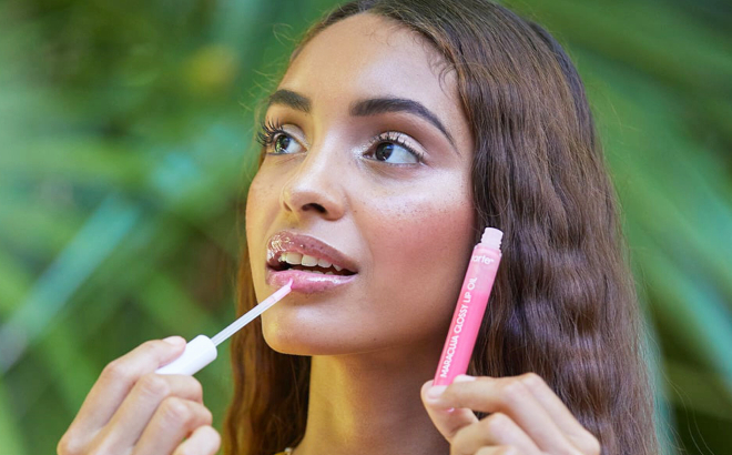 A Person Using a Tarte Maracuja Glossy Lip Oil