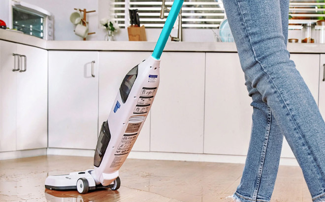 A Person Using the Tineco iFloor 2 Blue Cordless Wet Dry Vacuum