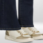 A Person Wearing No Boundaries Womens Lace Up Court Sneakers