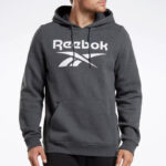 A Person Wearing a Reebok Pullover Hoodie in Dark Grey Heather