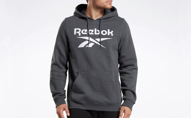 A Person Wearing a Reebok Pullover Hoodie in Dark Grey Heather