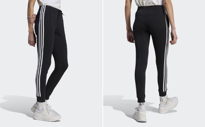 A Person Wearing the Adidas Essentials 3 Stripes Fleece Pants in Black