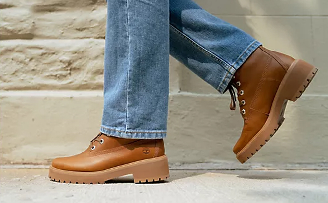 A Person Wearing the Timberland Leather or Suede 6 Inch Carnaby Cool Lace Up Boots