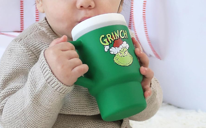 A Person drinking from Grinch Limited Edition My 1st Tumbler