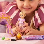 A Person playing with Rapunzel Disney Once Upon a Story Mini Doll Playset